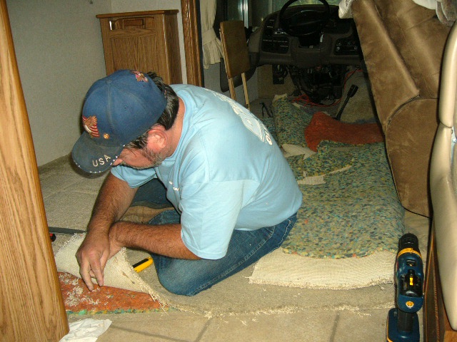 Removing the original carpet.