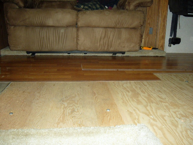 Installing the laminate wood floor.